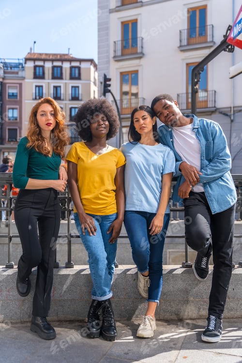 Preview: Portrait of happy multiethnic friends on city street, laughing together outdoors