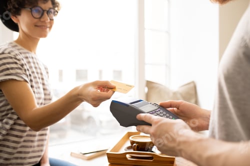 Preview: Lady giving credit card to cashier