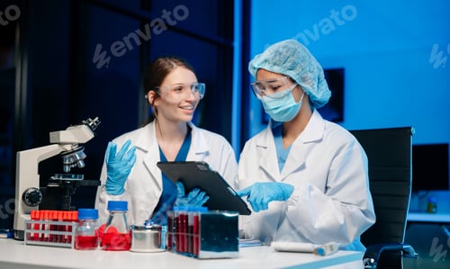 Preview: Modern Medical Research Laboratory Portrait of Two Scientists Working, Using Digital Tablet,