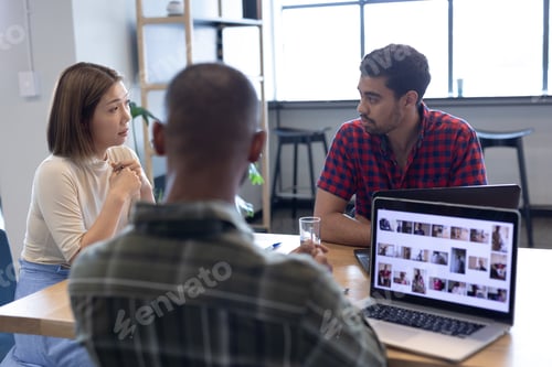 Preview: Diverse group of business people working in creative office