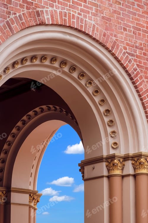 Preview: Decorative arch door with column on brick wall of the old church building in vertical frame