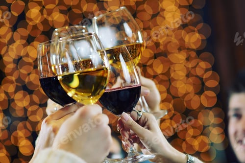 Preview: Hands holding the glasses of champagne and wine