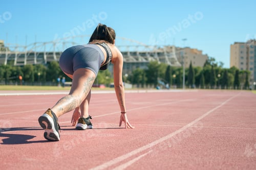 Preview: Fitness runner woman on running track working out