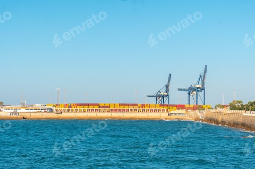 Preview: Commercial maritime and industrial cargo port with cranes from the city of Cadiz. Andalusia