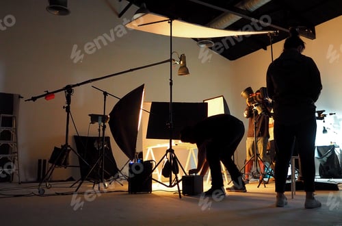 Preview: Silhouette of people working in production studio.