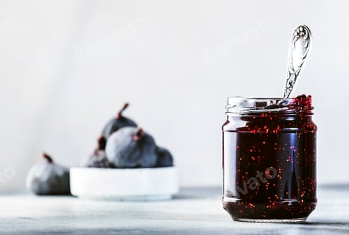Preview: Fig jam in glass jar with fresh blue figs. Homemade preparations and canning