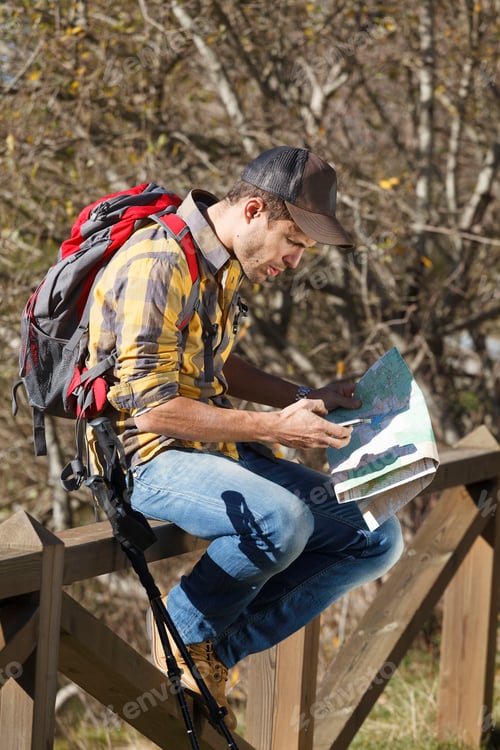 Preview: Hiker reading map on wooden handrail, Montseny, Barcelona, Catalonia, Spain