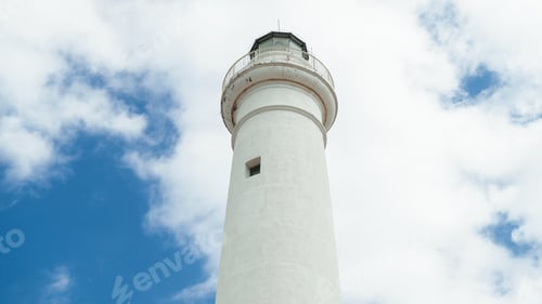 Preview: Lighthouse tower in daylight with clouds