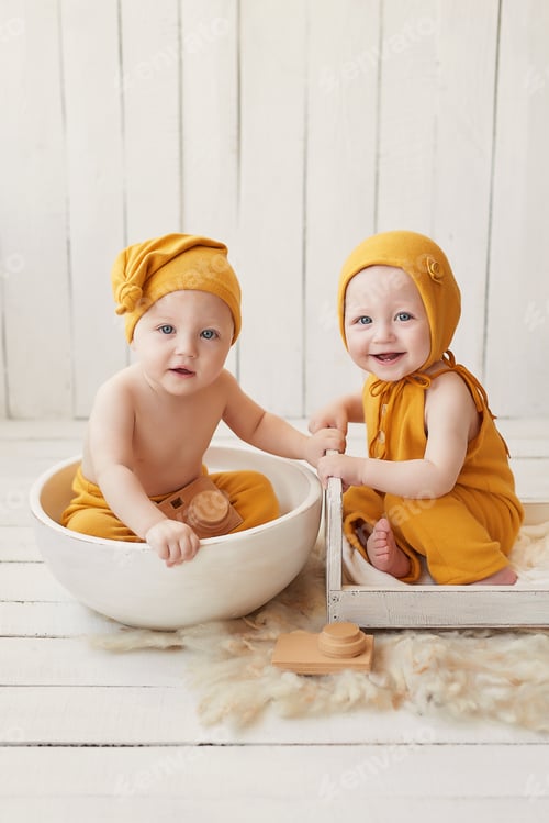 Preview: Adorable Babies in Mustard Outfits Sitting Posing Together