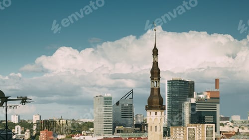 Preview: Tallinn, Estonia - July 1, 2019: Tower Of Town Hall On Background With Modern Urban Skyscrapers