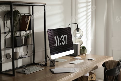 Preview: Modern computer and laptop on wooden desk in room. Interior design