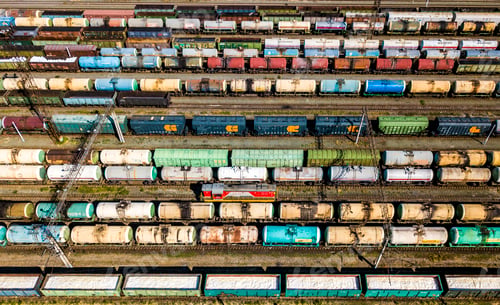 Preview: aerial top view of industrial cargo trains on a railway tracks f