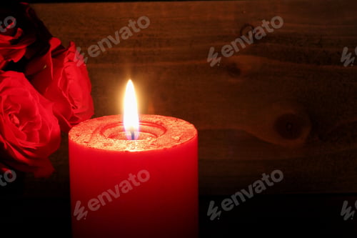 Preview: Red Candle Burning With Red Roses On Wooden Background - Photograph Of A Red Burning Candle With