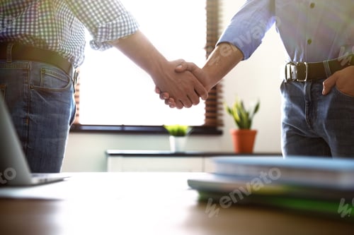 Preview: Business partners shaking hands after meeting, closeup