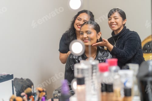 Preview: Two smiling make up artists posing with their client in a beauty salon