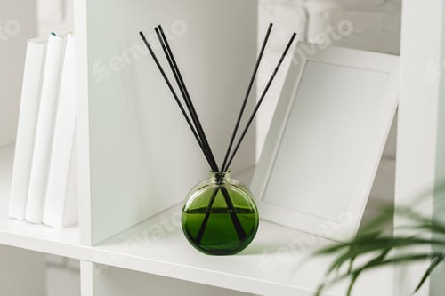 Preview: Elegant Reed Diffuser on White Shelf in a Modern Minimalist Interior Setting