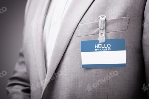 Preview: Businessman wearing Hello my name is tag