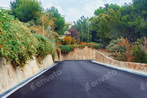 Preview: Picturesque concrete slope walkway with plants on the sides