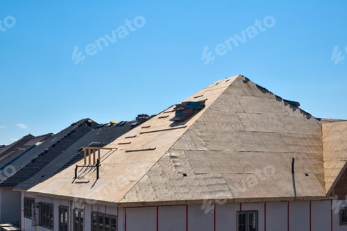 Preview: Plywood sheathing layer during roof building construction on new residential home