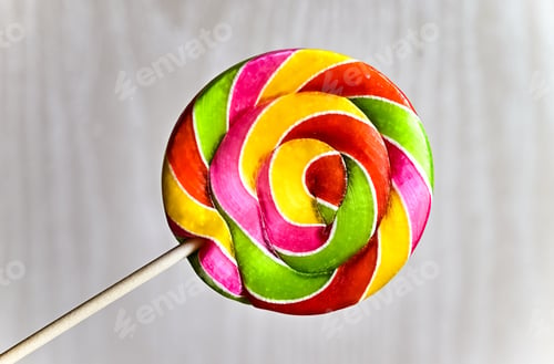 Preview: Multicolored lollipop on a light background.