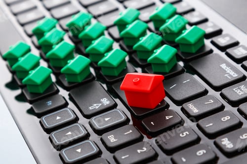 Preview: Small toy houses over keyboard