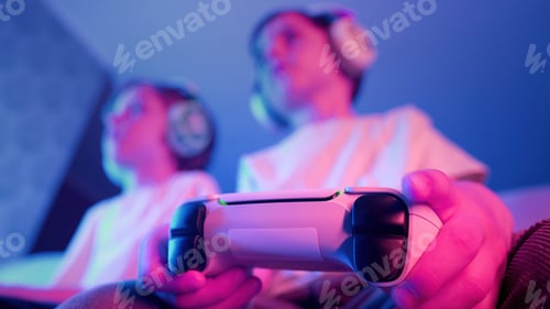 Preview: Excited Gamers Kids Brothers Playing Video Game On Console With Gamepad At Home