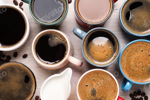 Preview: Many different cups of coffee and milk on white wooden table, flat lay