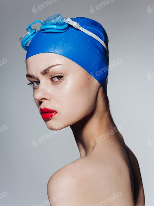 Preview: Woman in cap and goggles for swimming naked shoulders model portrait side view