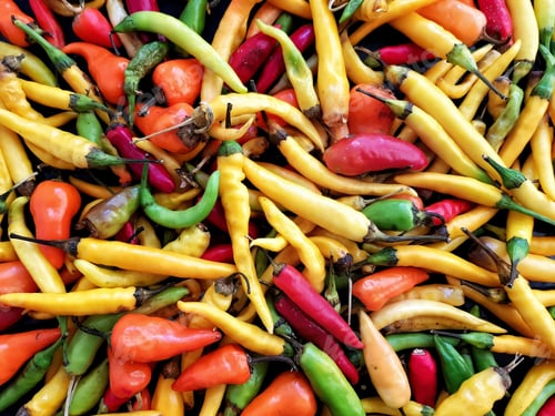 Preview: Colorful foods flat lay with red, green and yellow peppers.