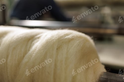 Preview: Merino wool fiber processing on textile production equipment closeup