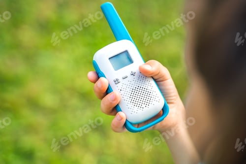 Preview: Small girl,kid play in walkie-talkie.Walkie Talkies with channels.Game of detectives, spies.Children
