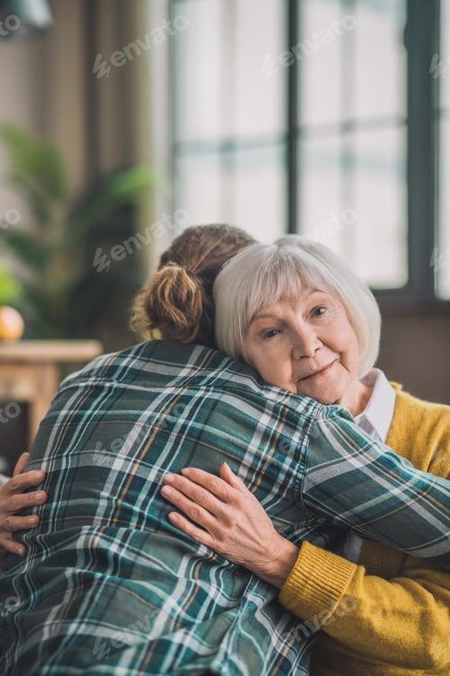 Preview: Grey-haired elderly lady feeling happy with her son