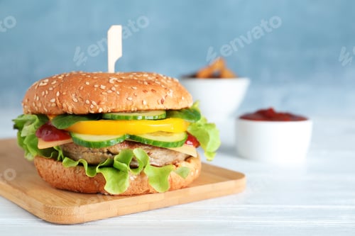 Preview: Board with delicious hamburger on table. Space for text