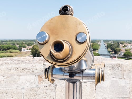 Preview: A Coin-operated binoculars looking out over a river landscape