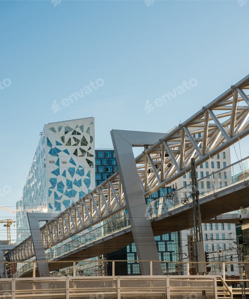 Preview: low angle view of bridge and contemporary buildings at railway station, Barcode district, Oslo