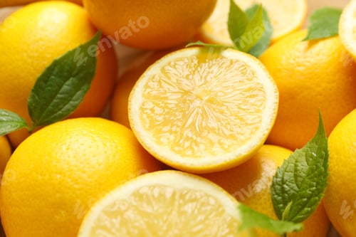 Preview: Lemons with leaves on whole background, close up. Ripe fruit