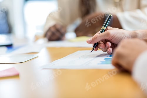 Preview: Pen making on paper business plan chart.