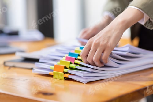 Preview: portrait of business Asian woman Accounting using calculating income-expenditure and analyzing real