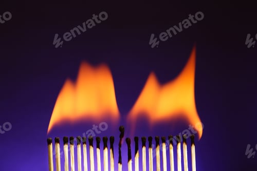 Preview: Line of burning matches on color background