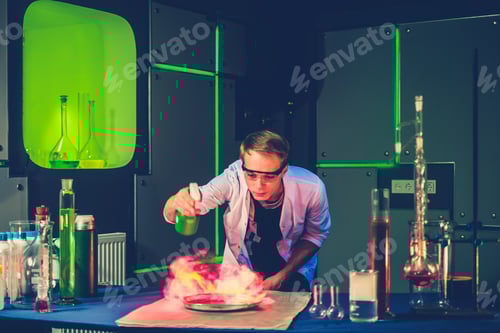 Preview: Young chemist making experiments in laboratory