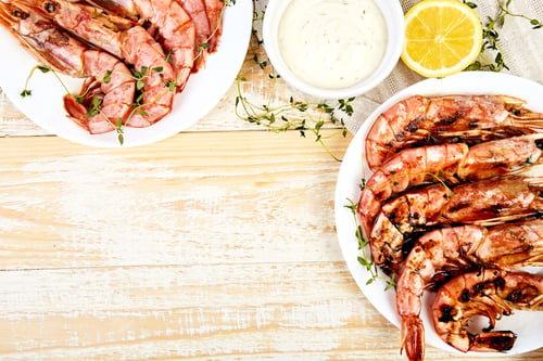 Preview: Grilled big tiger shrimps prawns on white plate