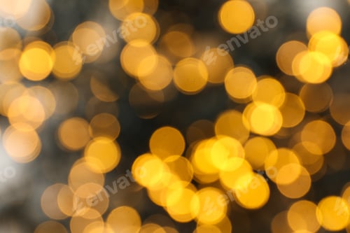 Preview: Blurred black garland with yellow lights on gray background