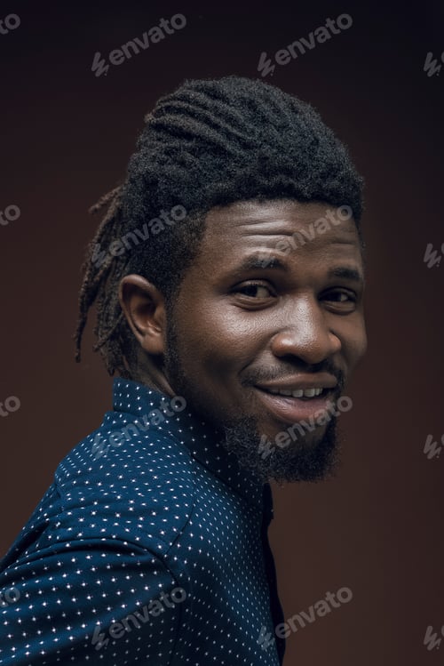 Preview: portrait of smiling african american man isolated on brown