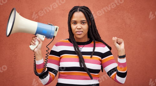 Preview: Protest, megaphone and portrait of a woman by a wall in the city for freedom, equality and human ri