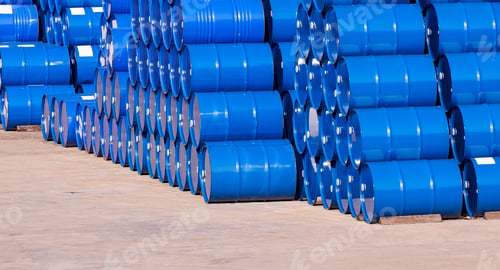Preview: Piles of many blue oil drums stacked on industrial yard area