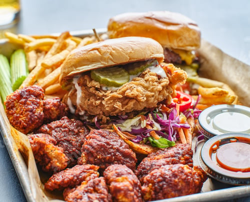 Preview: fried chicken sandwich and cheeseburger in tray with fries and boneless wings