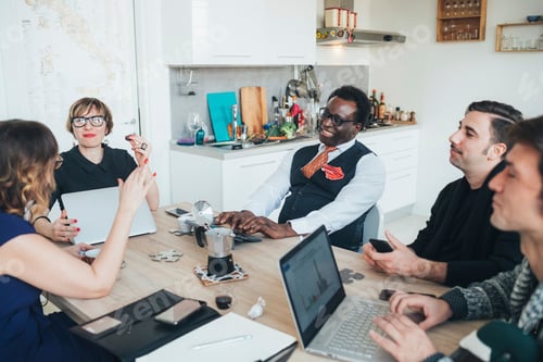 Preview: Businessmen and businesswomen having discussion in loft office