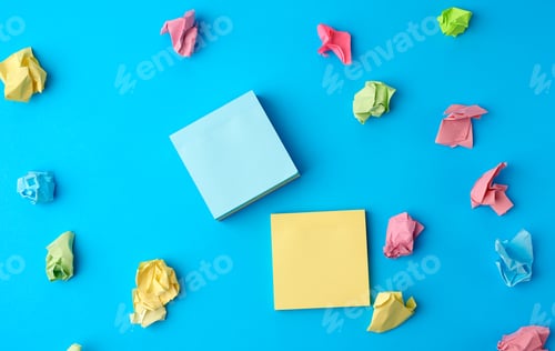 Preview: Multicolored blank paper stickers of different colors on a blue background