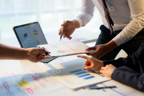 Preview: Business team analyzing financial data and company's marketing strategy