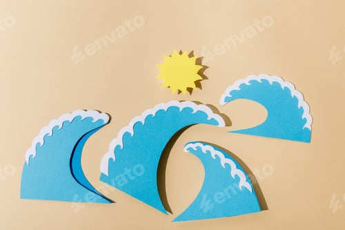 Preview: Top view of paper cut sun and sea waves on beige